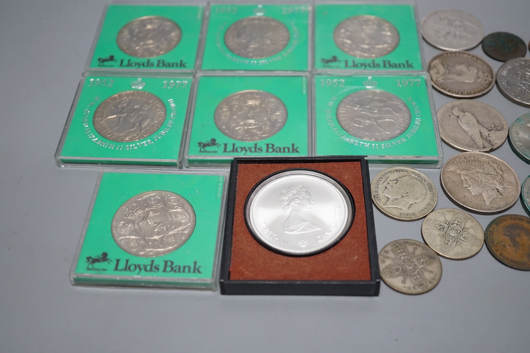 A group of mostly UK crowns and other coins, some pre-1920 silver coins and a 1976 Montréal Olympics commemorative silver coin